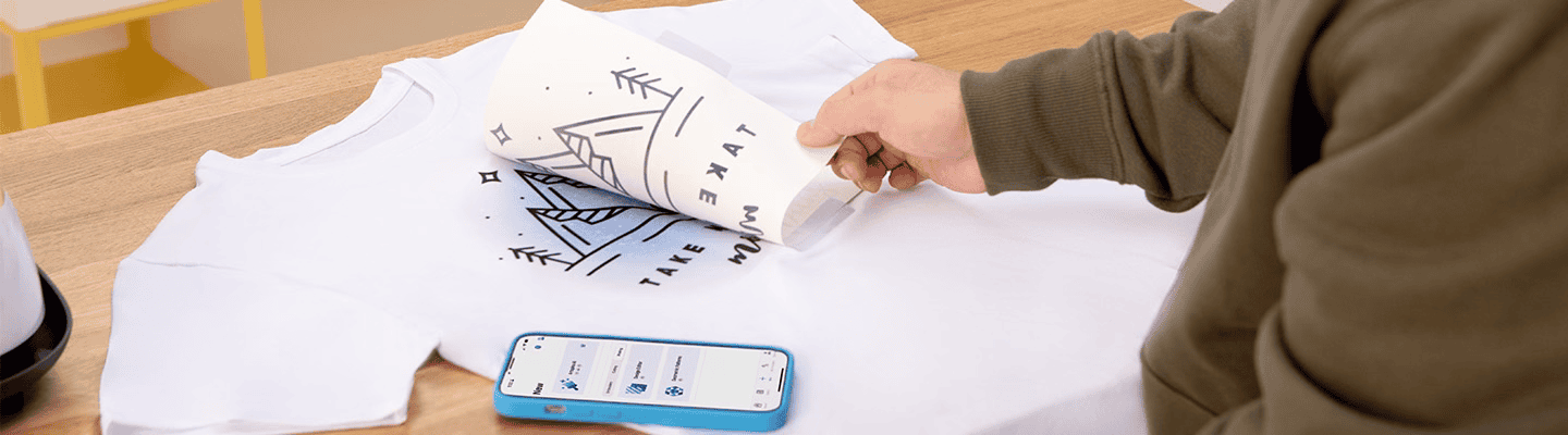 Artspira, Import your own designs and transfer wirelessly, photo showing phone connecting to sewing machine